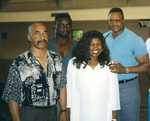 Jackie Sunshine Smith with Larry Holmes and Henry Ogelsby.jpg