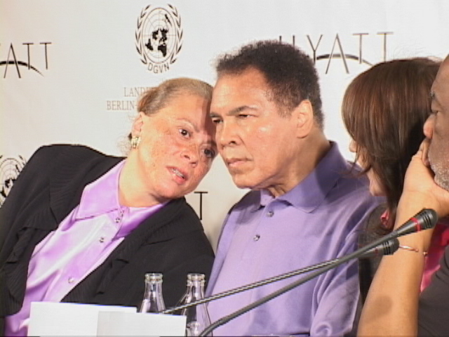 Mr and Mrs Muhammad Ali confer at UN Press Conf in Berlin.JPG